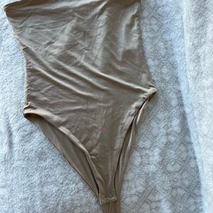 Tan Shapewear Bodysuit with High-Cut Leg Opening and Form-Fitting Design